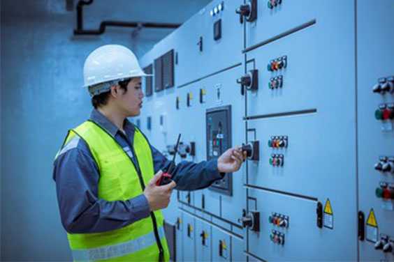 An-engineer-working-on-an-electrical-switchboard